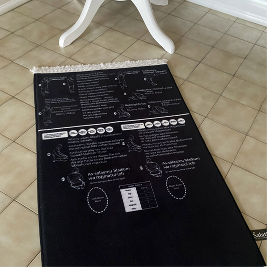 Padded prayer mat with step-by-step phonetics for Salat